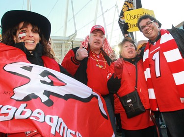 Calgary Mayor Naheed Nenshi poses with Calgary Stampeders fans outside B.C. Place before the 2014 Grey Cup in Vancouver on Sunday November 30, 2014.