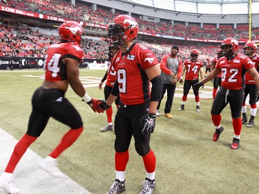 The Calgary Stampeders head out  to a warm-up in B.C. Place before the 2014 Grey Cup in Vancouver on Sunday November 30, 2014.
(Gavin Young/Calgary Herald)