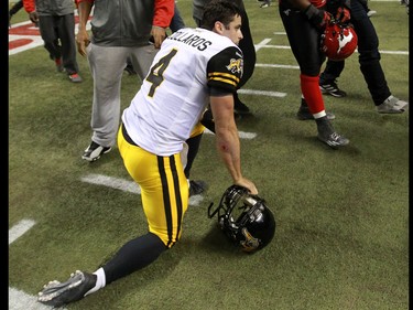 The Hamilton Tiger Cats QB Zach Collaros kneels on the field after the team lost the 2014 Grey Cup to the Calgary Stampeders in Vancouver on Sunday November 30, 2014.
(Gavin Young/Calgary Herald)