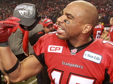 The Calgary Stampeders Marquay McDaniel holds his Grey Cup champions cap after the team won the 2014 Grey Cup in Vancouver on Sunday November 30, 2014.
(Gavin Young/Calgary Herald)