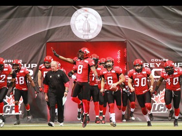 The Calgary Stampeders run onto the field at the start of the 2014 in 2014 Grey Cup in Vancouver on Sunday November 30, 2014.