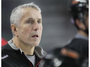 CALGARY, AB.; NOVEMBER 12, 2014  -- Calgary Flames coach Bob Hartley watches his troops during practice Wednesday November 12, 2014 at the Saddledome. (Ted Rhodes/Calgary Herald) For Sports story by Kristen Odland