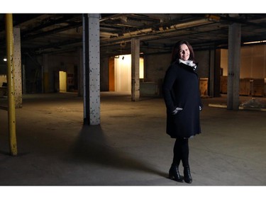 Eileen Stan, from Matco Development, stands inside the former Calgary Brewery site that the company proposes to redevelop on November 26, 2014.