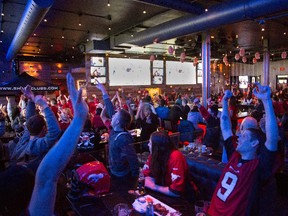 Stampeders fans celebrate the Grey Cup at Sharks Sports Bar Grill in N.E. Calgary on November 30th, 2014.