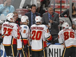 SUNRISE, FL - NOVEMBER 8: Head coach Bob Hartley of the Calgary Flames directs the players during a time out in the third period against the Florida Panthers at the BB&T Center on November 8, 2014 in Sunrise, Florida. The Flames defeated the Panthers 6-4.