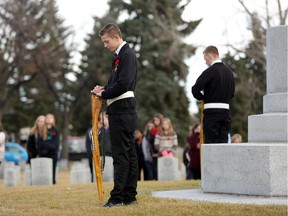 CALGARY;  NOVEMBER 05, 2014  -- Juno Beach Academy student honour guard during the No Stone Left Alone ceremony where Canadian Forces soldiers and students place poppies on all military gravesides at the Burnsland Cemetery in Calgary On november 6, 2014.  (Leah Hennel/Calgary Herald)   For City story by Annalise Klingbeil