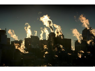 Steam rises from the high rises on a cold morning in Calgary Wednesday.