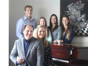 CALGARY, AB.; NOVEMBER 1, 2014  -- Calgary Philharmonic musical director Roberto Minczuk poses with his family at their Douglasdale home Sunday November 2, 2014. Pictured with Roberto is his wife Valeria and their children, from the left, Julia, 11, Rebecca, 20, Natalie, 22 and Joshua, 17. (Ted Rhodes/Calgary Herald) For Entertainment story by Mike Bell