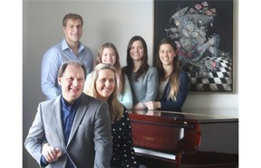 Calgary Philharmonic musical director Roberto Minczuk poses with his family at their Douglasdale home Sunday November 2, 2014. Pictured with Roberto is his wife Valeria and their children, from the left, Julia, 11, Rebecca, 20, Natalie, 22 and Joshua, 17.