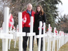 CALGARY, AB;  OCTOBER 30, 2014  -- Murray McCann and his granddaughter Kaitlin Knoll pose for a photo at the Field of crosses  in Calgary on October 30, 2014. 
 (Leah Hennel/Calgary Herald) 
 For City story by Valerie Fortney