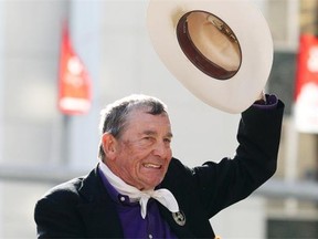 Calgary Stampede Marshal Ian Tyson waves to the crowd along 6 Ave. S.W. in Calgary, Alberta Friday, July 6, 2012.