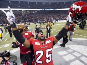 Calgary Stampeders defensive back Keon Raymond celebrates his teams win against the Hamilton Tiger-Cats during the 102nd Grey Cup in Vancouver, B.C. Sunday, Nov. 30, 2014.