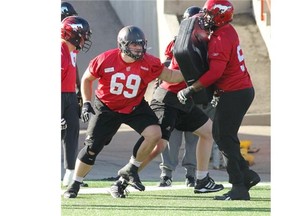 Calgary Stampeders offensive lineman Brett Jones works on a drill during Stamps practice at McMahon Stadium on Wednesday.