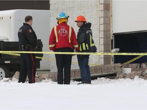 Calgary,Alberta; Nov. 20, 2014 -- Officials investigate an industrial accident at the 600 block of 28 street N.E. Thursday afternoon as a wall collapsed on a worker.  ({David Moll}/Calgary Herald) For {N} story by {}