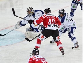 Canada’s Alexandre Bolduc, center, scores to 1:0 against Vitkovice’s goalkeeper Filip Sindelar, left, and Gian Andrea Randegger during the game between Team Canada and HC Vitkovice Steel at the 87th Spengler Cup in Davos.