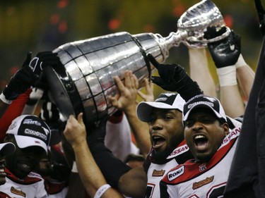 Saleem Rasheed, centre, and Jeremaine Copeland celebrate their 22-14 win in the 2008 Grey Cup.