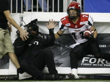 Brett Ralph of the Calgary Stampeders scores while knocking over a cameraman during 2nd-quarter action in the 2008 Grey Cup.