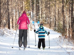 Skiers enjoy the Trans Canada Trail in Kananaskis. The trail should not be rerouted to roads and highways, says the Herald editorial board.