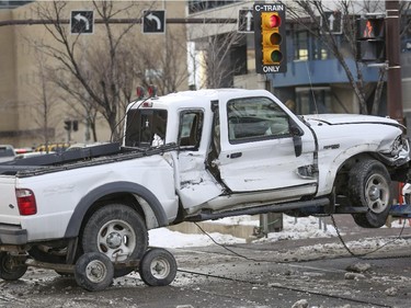 A truck is hit by the C-train while crossing the track at the intersection of 9 Street SW and 4 Avenue SW in Calgary, on November 20, 2014. --