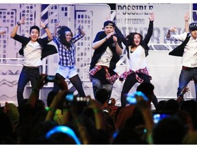 Dancers III Fx perform at the start of  We Day at the Saddledome in Calgary Monday November 3, 2014.