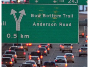 The taillights of evening rush-hour traffic light up Deerfoot Trail.