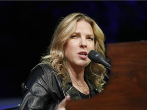 This July 21, 2013 photo, Diana Krall performs at the Jazz Festival of 5 Continents, in Marseille, southern France. Krall is canceling her U.S. fall tour to give herself time to recuperate from a severe case of pneumonia. Krall, in a statement released Thursday, Sept. 25, 2014,  by her publicist, says she's "deeply saddened" about the postponement, but is "under doctor's orders to rest for the next few months in order to regain my strength and good health."(AP Photo/Claude Paris)