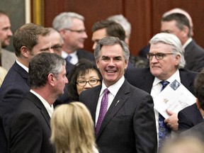 Alberta Premier Jim Prentice is welcomed into the legislature during the speech from the throne at the Alberta Legislature in Edmonton, on Monday November 17, 2014.