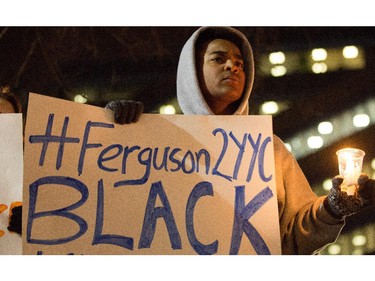 Habtamu Hailu shows his support to Ferguson as part of the 'Black Lives Matter' protest at Calgary City Hall on Tuesday November 25, 2014.