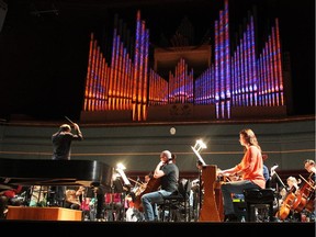 Members of the Calgary Philharmonic Orchestra rehearse for their I Love Paris Festival featuring a visual installation, Tarangalila.