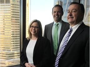 Cushman & Wakefield associate vice-president of industrial sales and leasing, Tracy Taylor  Fullerton, left, and vice-president of office leasing, centre, Andrew MacLachlan, with senior managing director Bob MacDougall on November 12, 2014.