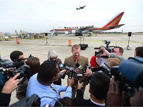 Ebola survivor, Dr. Kent Brantly speaks to reporters and photographers at Charlotte Douglas International Airport  Wednesday, Nov. 5, 2014, in Charlotte, N.C. International Christian charity Samaritan's Purse loaded a cargo jet with tons of Ebola relief supplies for shipment to Africa.