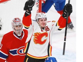 Flames winger Curtis Glencross celebrates a goal on Montreal’s Carey Price on Sunday.