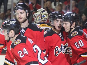 The Calgary Flames, from the left, Jiri Hudler, TJ Brodie, Johnny Gaudreau, Markus Granlund and Mark Giordano, celebrate a goal.