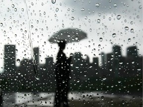 File photo: Rainy Calgary from Crescent Road looking over the city skyline after an intense thunderstorm rolled across the city.