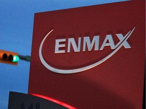 NOVEMBER 05, 2014 --  STK. Traffic light behind an Enmax sign at the company's head office in Calgary.