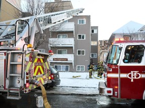 Calgary firefighters deal with an afternoon apartment fire in the Diplomat Apartment building at 709 14th Avenue S.W. on Friday, November 14.