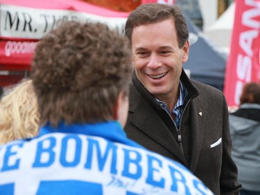 CFL Commissioner Mark Cohen greets fans at the Calgary Grey Cup Committee pancake breakfast at Canada Place in Vancouver on Thursday, November 27, 2014.