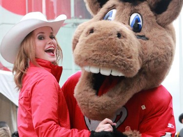 Charlie the Stampeders mascot dances up a storm with a Calgary Stampeders Outrider Taylor at the Calgary Grey Cup Committee pancake breakfast at Canada Place in Vancouver on Thursday November 27, 2014.