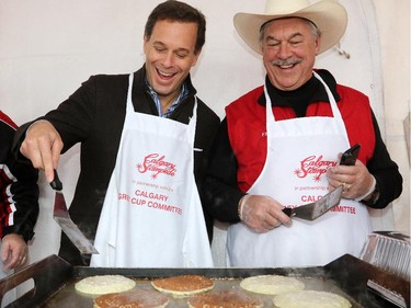 CFL Commissioner Mark Cohen tries his hand at pancake flipping at the Calgary Grey Cup Committee pancake breakfast at Canada Place in Vancouver on Thursday November 27, 2014.
