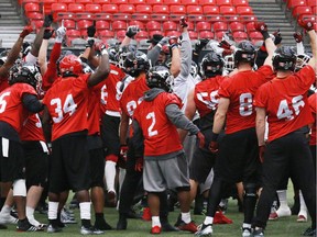The Calgary Stampeders do a team cheer at the start of practice at BC Place on Friday. Chemistry is a big reason for the success of their defence.
