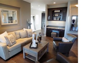 The great room in a show home by WestCreek Homes in Legacy. It also features a fireplace with a floor-to-ceiling stone face. Marty Hope for the Calgary Herald