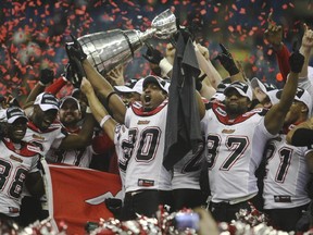 MONTREAL, QC: NOVEMBER 23, 2008 -- Calgary Stampeders players celebrate their 22-14 win at the 2008 Grey Cup final between the Montreal Alouettes and the Calgary Stampeders November 23, 2008 at Olympic Stadium in Montreal.    (Ted Rhodes / Canwest News Service)