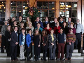 Calgary Herald Editor  Lorne Motley and Managing Editor Monica Zurowski join the 2014 Calgary Herald Christmas Fund recipients at Heritage Park in Calgary on November 18, 2014.