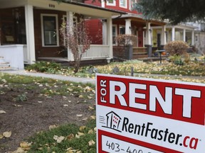 For rent signs are seen on front lawns in Calgary, on October 26, 2014.