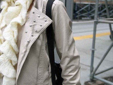Small details, like studs on the jacket and the texture in the scarf, make the outfit.