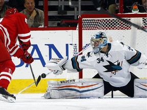 Carolina Hurricanes' Jeff Skinner (53) has his shot blocked by San Jose Sharks goalie Troy Grosenick (34) during the first period of an NHL hockey game in Raleigh, N.C., Sunday, Nov. 16, 2014. Grosenick faced 45 shots in the Sharks 2-0 shut out, setting a new NHL record for most saves in a shutout debut.
