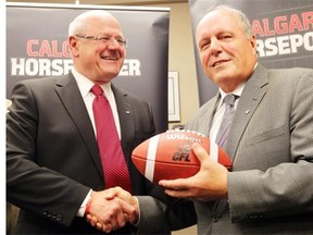 John Forzani, shown with Ken King in 2012, was remembered by former Stampeders teammate and business partner Basil Bark as “A great teammate. A great friend. A great man.”