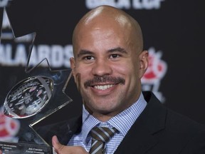 Jon Cornish of the Calgary Stampeders celebrates his most outstanding Canadian player of the year award during the CFL Awards in Vancouver, B.C. Thursday, Nov. 27, 2014.