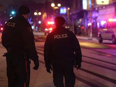 Police control the scene of an armed robbery at the Bank of Montreal, 2302 4th Ave S.W., in this file photo.