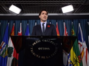 Liberal Leader Justin Trudeau announces at a news conference on Parliament Hill in Ottawa Nov. 5, 2014, that he is turfing Massimo Pacetti and Scott Andrews from the Liberal caucus.